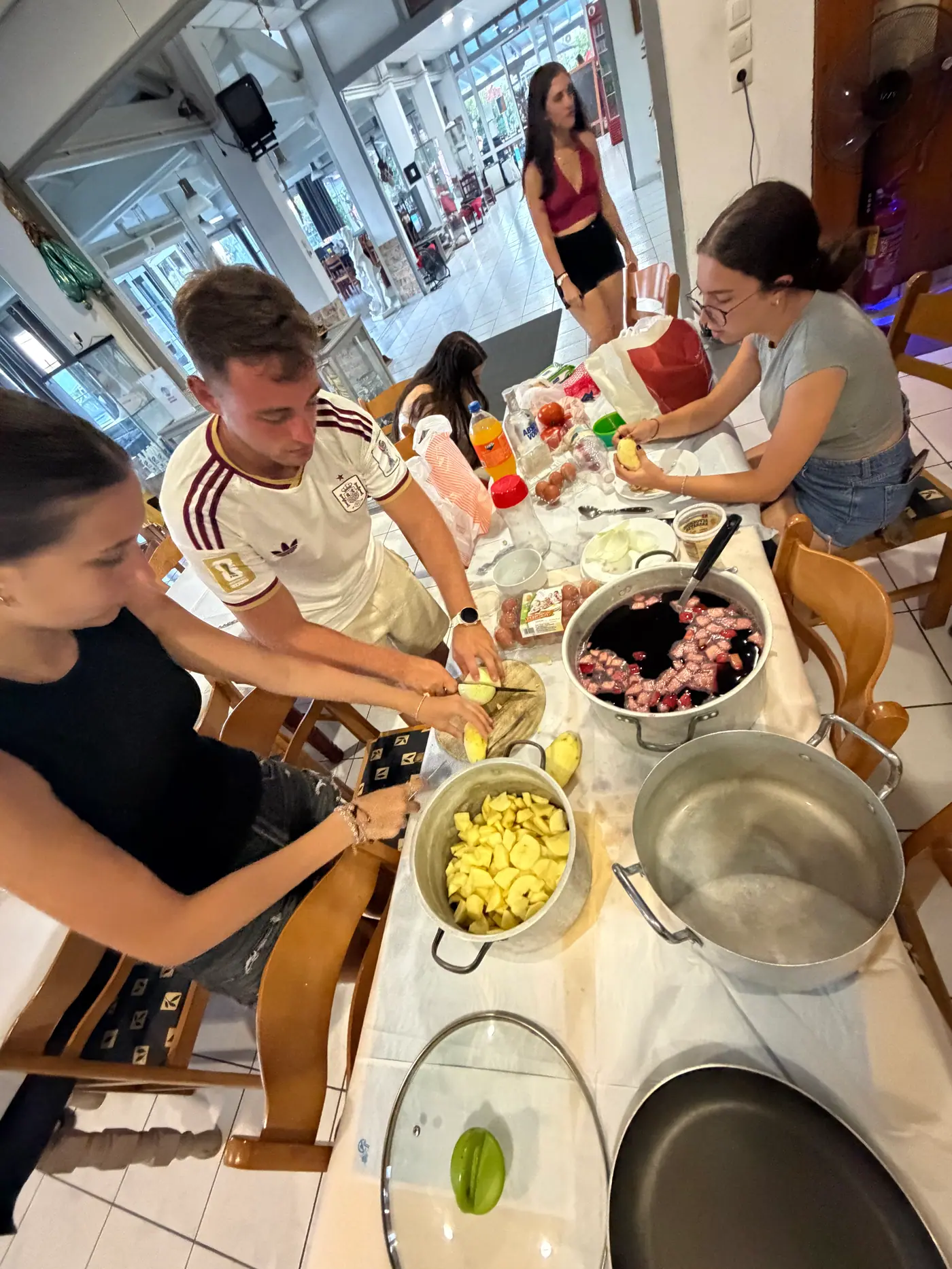 Day 5 in Sounio, at the shared international meal prepared by the four national teams. Photo 4 of 22.